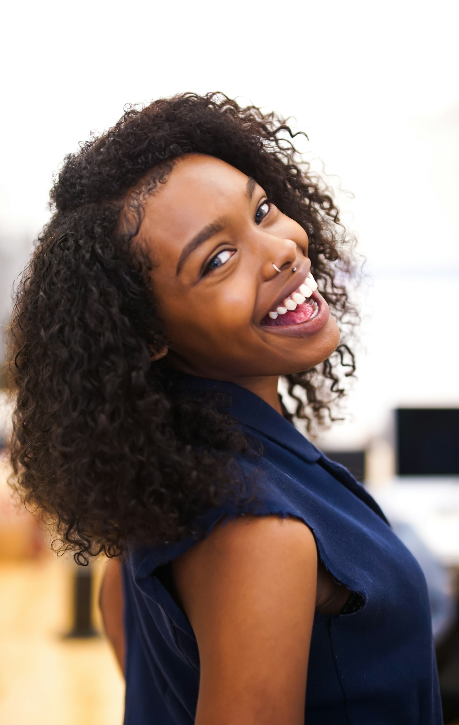 Smiling woman with natural curls